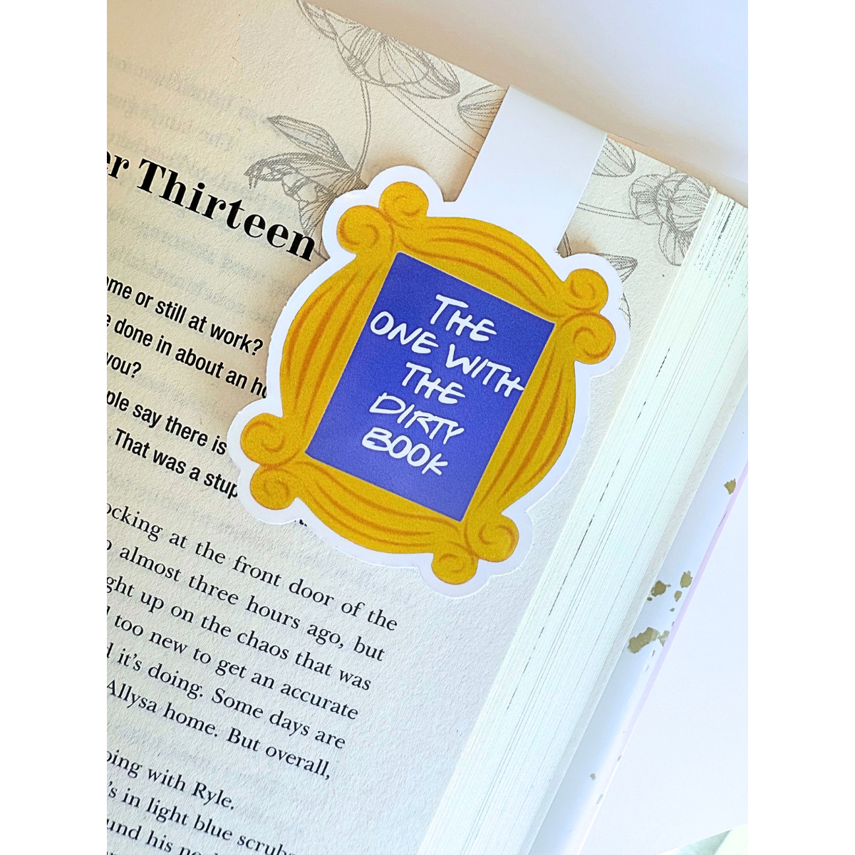 The one with the dirty book frame magnetic bookmark